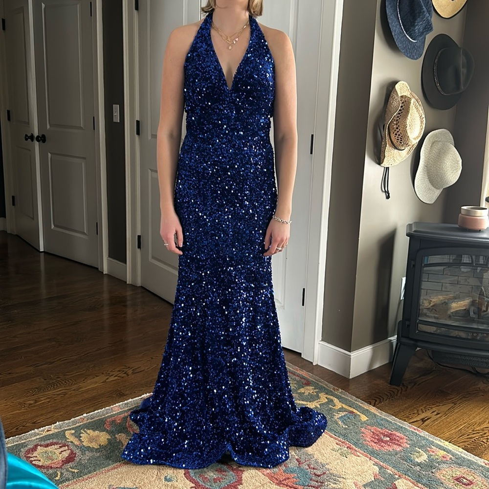 Stunning rich blue sequined gown.